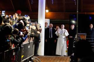 Pope Francis greets the crowd outside the church after celebrating Mass at the parish of St. Mary in the Setteville neighborhood of Rome Jan. 15.