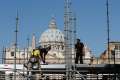 Workers erect a media platform outside St. Peter&#039;s Square at the Vatican April 22 in preparation for the April 27 canonization of Blesseds John XXIII and John Paul II.