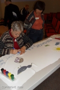 Wendy Whittam of St. Mark’s United Church in Scarborough works on a banner for the Roll with the Declaration. The KAIROS program will take place in Ottawa on June 20.