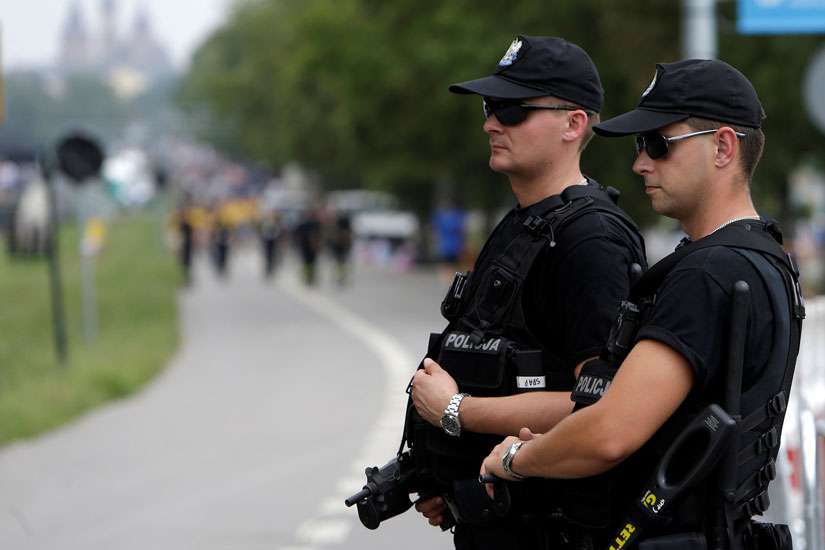 Police officers stand guard during World Youth Day in Krakow, Poland, July 26. Mariusz Ciarka, spokesman for Poland&#039;s Warsaw-based police headquarters, said Polish police have raised the official threat level after an Iraqi man was arrested with traces of explosives.