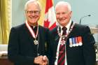 Governor General David Johnston invested Winnipeg Archbishop-emeritus James Weisgerber, left, as an Officer of the Order of Canada Sept. 12.
