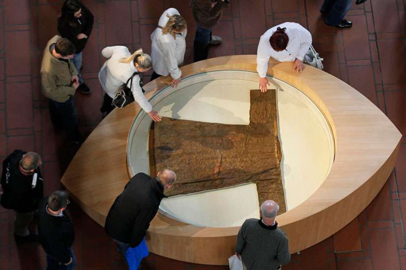 Pilgrims touch a casing containing the &quot;&#039;Holy Robe&quot; in the cathedral in Trier, Germany, April 15. The ancient town of Trier marks the 500th anniversary of the first public appearance of the Seamless Robe of Jesus, reportedly worn during, or shortly before his crucifixion. Some 500,000 pilgrims are expected to visit the relic through May 13.