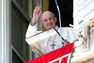 Pope Francis greets the crowd as he leads the Angelus from the window of his studio overlooking St. Peter&#039;s Square at the Vatican Sept. 6, 2020. During his address, the pope spoke about the dangers of gossip in the church.