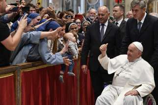 Pope Francis greets the faithful after Mass in St. Peter’s Basilica at the Vatican Oct. 29, marking the conclusion of the first session of the Synod of Bishops on synodality.