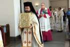Msgr. Makarios Wehbi (with book) is followed by Bishop John Boissonneau in the entrance procession for the World Day of Migrants and Refugees Mass Sept. 23 at Markham’s Cathedral of the Transfiguration.