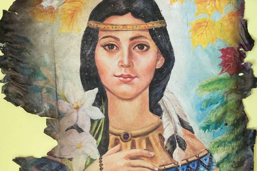 The Easter Sunday fire quickly consumed the coummunity church. In the charred remains, a picture of St. Kateri Tekakwitha somehow survived, as well as a Mary statue.