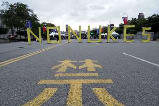 A sign with the words NO NUKES is seen in front of the Presidential Office Building during an anti-nuclear protest March 3 in Taipei, Taiwan.