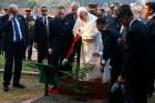 Pope Franci waters a tree he planted during a visit to the National Martyrs&#039; Memorial in Savar, Bangladesh, Nov. 30.