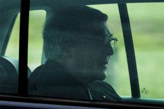 Cardinal George Pell is seen in a car after being released from Barwon prison in Geelong, Australia, April 7, 2020.