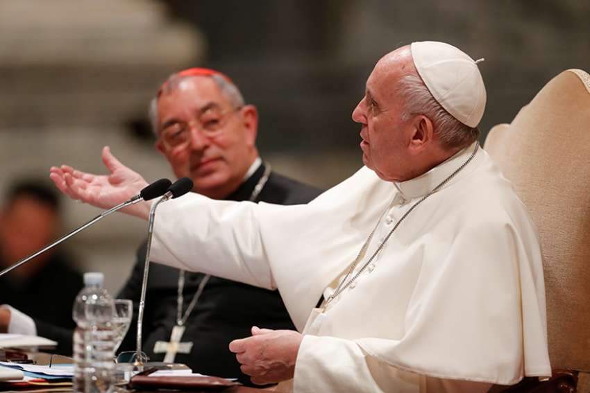 Pope Francis gestures as he addresses more than 1,000 diocesan leaders, both clergy and laity, May 9, 2019, at the Basilica of St. John Lateran, the cathedral of the Diocese of Rome. Seated next to the pope is Cardinal Angelo de Donatis, vicar of Rome. 