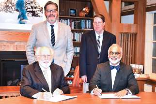 Top row (L-R): David Sylvester, President, University of St. Michael’s College; Thomas Worcester, President, Regis College. Bottom row (L-R):  Peter Warrian, Chair, Regis College Governing Council; Paul Harris, Chair, University of St. Michael’s College Collegium.
