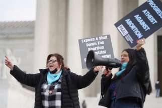 Activists Lauren Handy, left, and Terrisa Bukovinac chant slogans against legal abortion outside the Supreme Court in Washington Dec. 10, 2021. Handy and Bukovinac, members of a group called Progressive Anti-Abortion Uprising, said at an April 5,2022, news conference that five fetuses police found in a member&#039;s District of Columbia home are &quot;proof of illegal abortions.&quot; The group said they found the five fetuses and a number of others in medical waste discarded by an abortion clinic in the District.