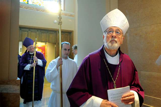 Retired Milwaukee Archbishop Rembert G. Weakland enters St. John the Evangelist Cathedral in Milwaukee during a farewell Mass for Archbishop Timothy M. Dolan, seen at left, as head of the Milwaukee Archdiocese in this 2009 photo.
