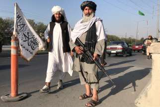 Taliban fighters stand outside the Interior Ministry in Kabul, Afghanistan, Aug. 16, 2021. During his Angelus address Aug. 15, Pope Francis expressed his concern for Afghanistan amid the Taliban&#039;s control of the country.