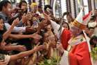 Pope Francis greets young people after celebrating Mass with youths Nov. 30 at St. Mary&#039;s Cathedral in Yangon, Myanmar. Foreign trips, a focus on the rights and needs of migrants and refugees and a Synod of Bishops dedicated to young people all are on the 2018 calendar for Pope Francis.