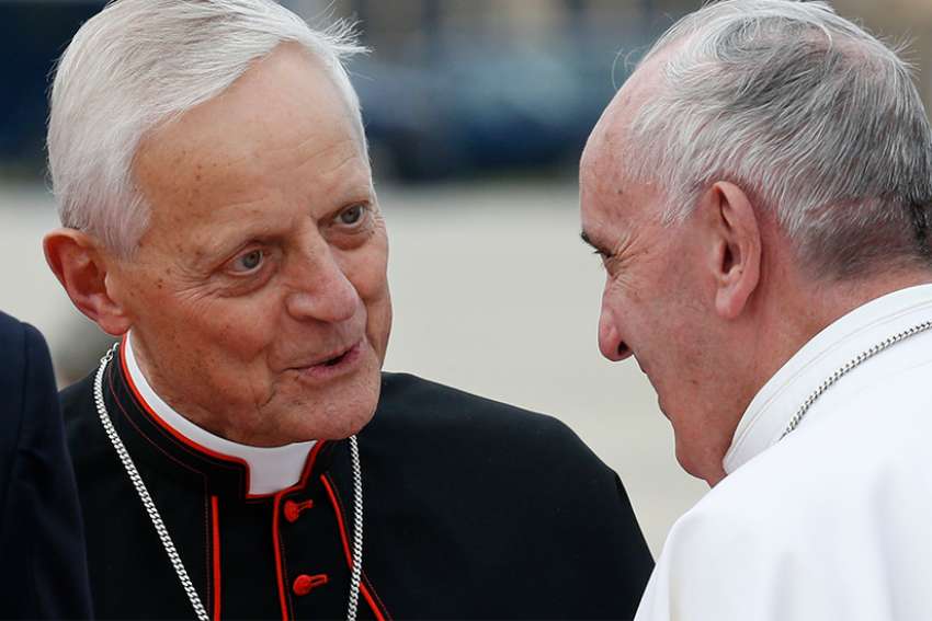 Cardinal Donald W. Wuerl of Washington talks with Pope Francis at Andrews Air Force Base in Maryland near Washington Sept. 22, 2015. 