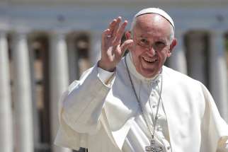 Pope Francis waves as he arrives for his general audience in St. Peter&#039;s Square May 17 at the Vatican.