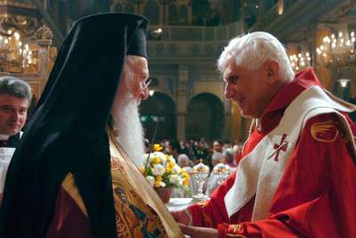 Ecumenical Patriarch Bartholomew and Pope Benedict XVI exchange greetings during a visit to Holy Spirit Cathedral in Istanbul, Turkey, Dec. 1, 2006.