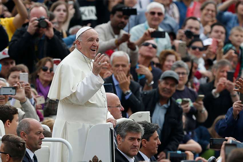 Pope Francis greets the crowd during his general audience in St. Peter&#039;s Square at the Vatican May 23. 
