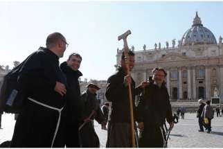 A group of Franciscans representing the four branches of the Franciscan family arrive in St. Peter&#039;s Square March 12 after walking from Assisi to Rome.