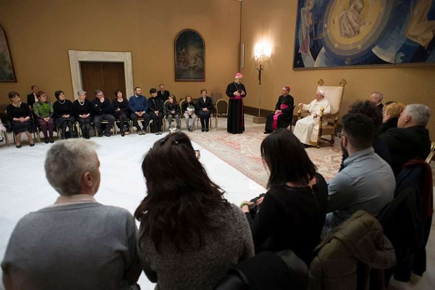 Pope Francis attends a private audience Feb. 22 at the Vatican for Italian family members of those who died in the 2016 Dhaka massacre in Bangladesh.