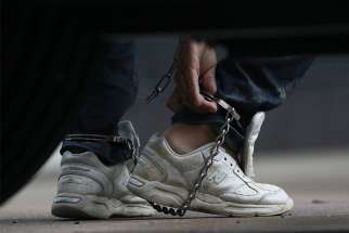 An immigrant entering the U.S. illegally is seen arriving in shackles for a court hearing in McAllen, Texas, June 22.