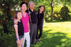 Pauliana and Thomas Kung with their granddaughters Madison and Rachel.