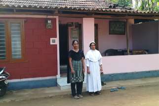 Sister Regin Mathew, right, helped Vincy Joy, a 42-year-old woman, overcome trauma after floodwaters submerged her house on the outskirts of Mananthavady, India, a town in Kerala state.