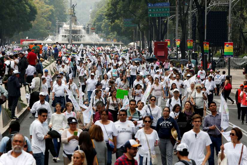 People arrive to participate in a march against the legalization of same-sex marriage Sept. 24 in Mexico City.