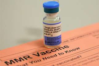 A vial of the vaccine for measles, mumps and rubella and an information sheet is seen at Boston Children&#039;s Hospital Feb. 26, 2015. 