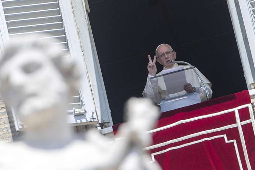 Pope Francis gestures as he leads the Angelus from the window of his studio overlooking St. Peter&#039;s Square July 29 at the Vatican.
