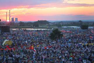 The sun sets over World Youth Day pilgrims as Pope Francis attends a July 30 prayer vigil at the Field of Mercy in Krakow, Poland.