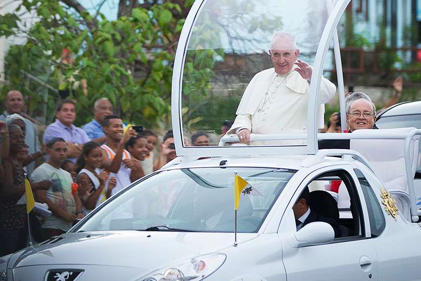 Pope Francis waves to crowd near Havana&#039;s apostolic nunciature after his Sept. 19 arrival in Cuba.
