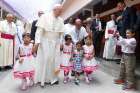 Pope Francis walks with children as he visits the Mother Teresa House in the Tejgaon neighborhood in Dhaka, Bangladesh, Dec. 2.