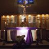 Fr. Michael Pace places the monstrance on the altar of St. Benedict’s Church in preparation for eucharistic adoration at the youth ministry-run event called The Visitation.