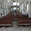 Church pews are seen amid rubble in the destroyed Sacred Heart Church after the 2010 earthquake in the Turgeau neighborhood of Port-au-Prince, Haiti.