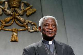 Cardinal Peter Turkson, chancellor of the Pontifical Academy of Social Sciences, is seen in a file photo from a news conference at the Vatican Dec. 21, 2021. Under the cardinal&#039;s leadership, the academy published a document encouraging Catholic institutions to integrate the church&#039;s social teaching into their investment policies.