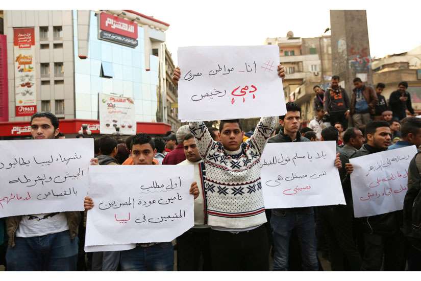 Egyptian Christians hold placards during a Feb. 16 protest in Cairo against what is said to be the killing of Coptic Christians by Islamic State militants in Libya. Egyptian jets bombed Islamic State targets in Libya Feb. 16, a day after the group there released a video showing what is said to be the beheading of 21 Egyptian Christians.