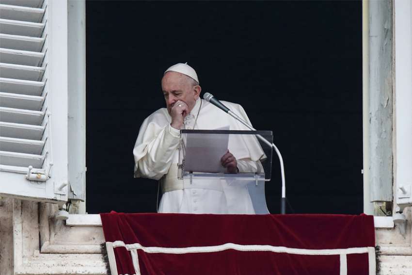 Pope Francis coughs as he leads the Angelus from the window of his studio overlooking St. Peter&#039;s Square at the Vatican March 1, 2020.