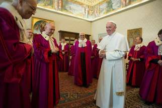 Pope Francis greets members of the Roman Rota during a meeting inaugurating the judicial year at the Vatican Jan. 22, 2016. Pope Francis named two new members to the Roman Rota July 20 as part of his ongoing effort to restructure the Roman Curia.