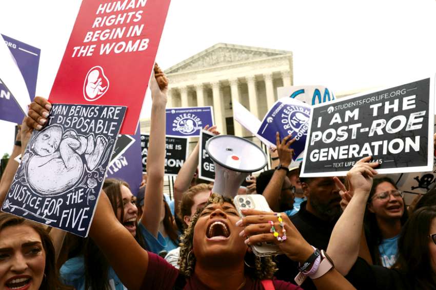 Pro-life demonstrators in Washington celebrate outside the Supreme Court June 24 as the court overruled the landmark Roe v. Wade abortion decision.