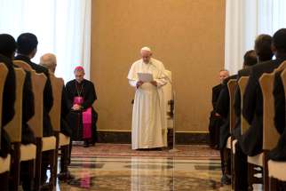  Pope Francis leads an audience with faculty and staff of the Jesuits&#039; International College of the Gesu at the Vatican Dec. 3. The pope, a Jesuit, told his brethren that they have to be lambs when fighting the wolves.