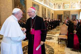 Pope Francis greets Archbishop Piero Marino, president of the Pontifical Committee for International Eucharistic Congresses, during an audience with members of the committee at the Vatican Nov. 10. The next Eucharistic Congress will be held Sept. 13-20, 2020, in Budapest, Hungary. 
