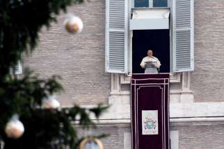 The Christmas tree is seen as Pope Francis leads the Angelus from the window of his studio overlooking St. Peter&#039;s Square at the Vatican Jan. 9, 2022. The pope prayed for peace in Kazakhstan.