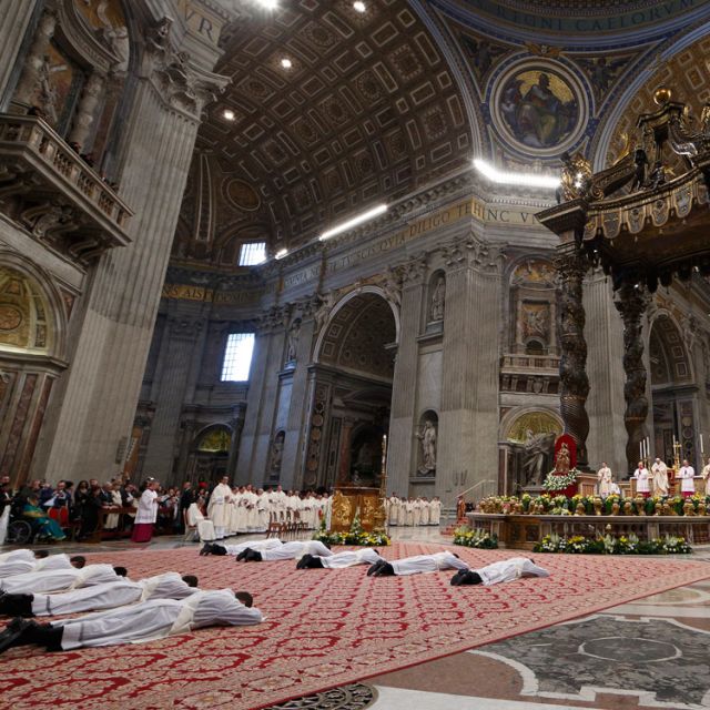 Ten priests lie prostrate during their ordination by Pope Francis in St. Peter&#039;s Basilica at the Vatican April 21.