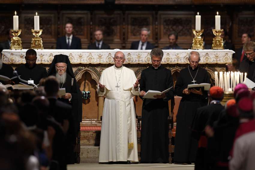 Ecumenical Patriarch Bartholomew of Constantinople, Pope Francis, an unidentified clergyman and Anglican Archbishop Justin Welby of Canterbury, England, attend an ecumenical prayer service with other Christian leaders in the Basilica of St. Francis in Assisi, Italy, in 2016.
