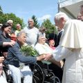 Pope Benedict XVI shakes hands with people during his visit to the church of St. Catherine of Alexandria June 26, after it was damaged in a late-May earthquake in Rovereto di Novi, Italy. Father Ivan Martini was killed May 29 when falling debris crashed on top of him while he was trying to save sacred and liturgical objects in the church.