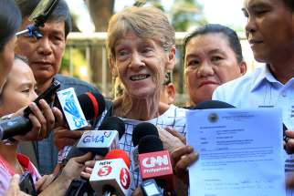 Sister Patricia Fox, superior of the Sisters of Our Lady of Sion in the Philippines, speaks to the media after her April 17 release from the Bureau of Immigration headquarters in Manila. Philippine authorities arrested the 71-year-old Australian nun for allegedly engaging in illegal political activities.