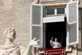 Pope Francis greets the crowd as he leads the Angelus from the window of his studio overlooking St. Peter&#039;s Square at the Vatican Oct. 25, 2020. The pope at the Angelus announced that he will create 13 new cardinals at a Nov. 28 consistory.