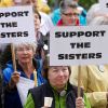A group of supporters of American nuns takes part in a vigil outside Seattle’s St. James Cathedral